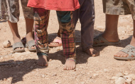 Feet of children in IDP camp